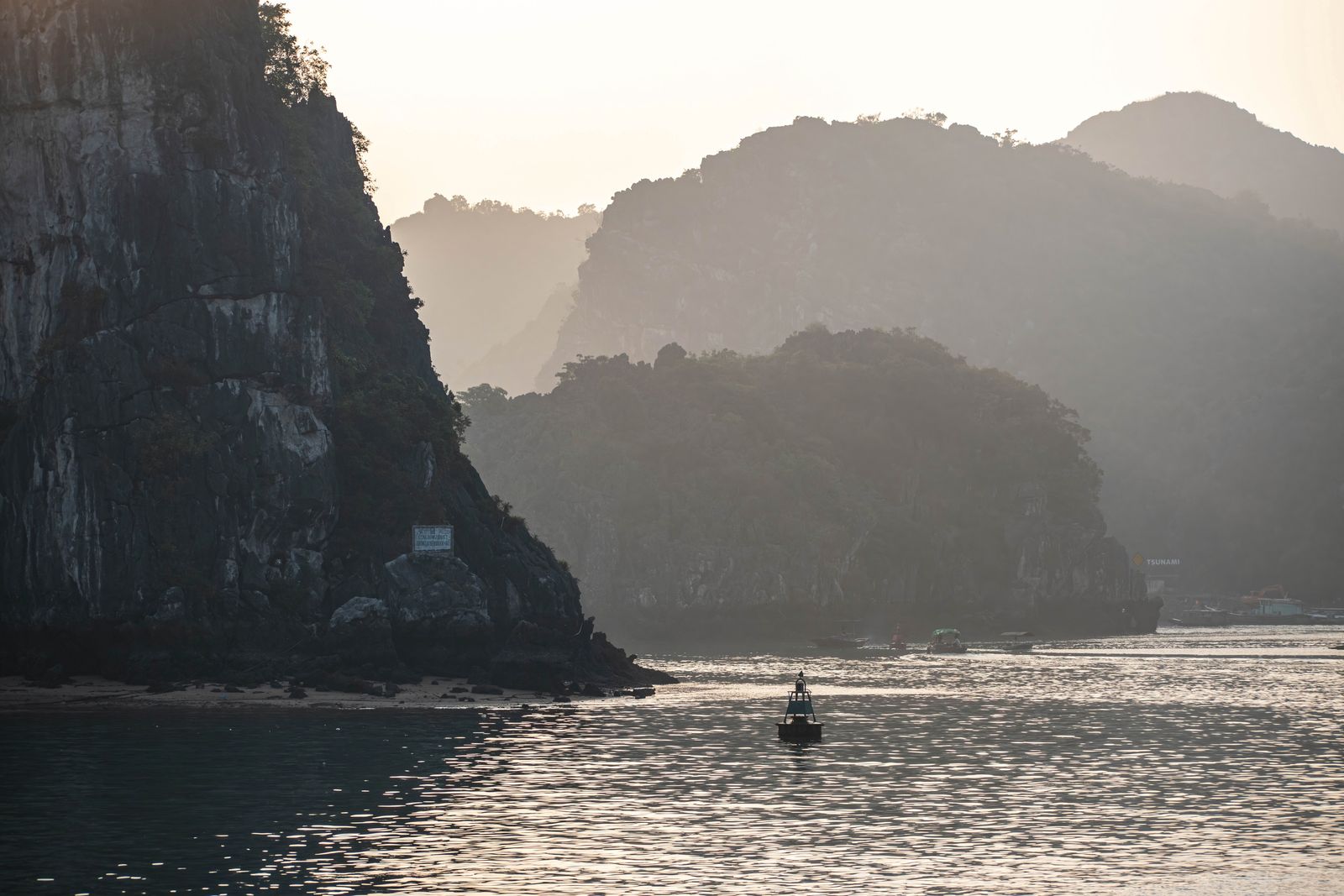 Rock formations rising from the water in Halong Bay