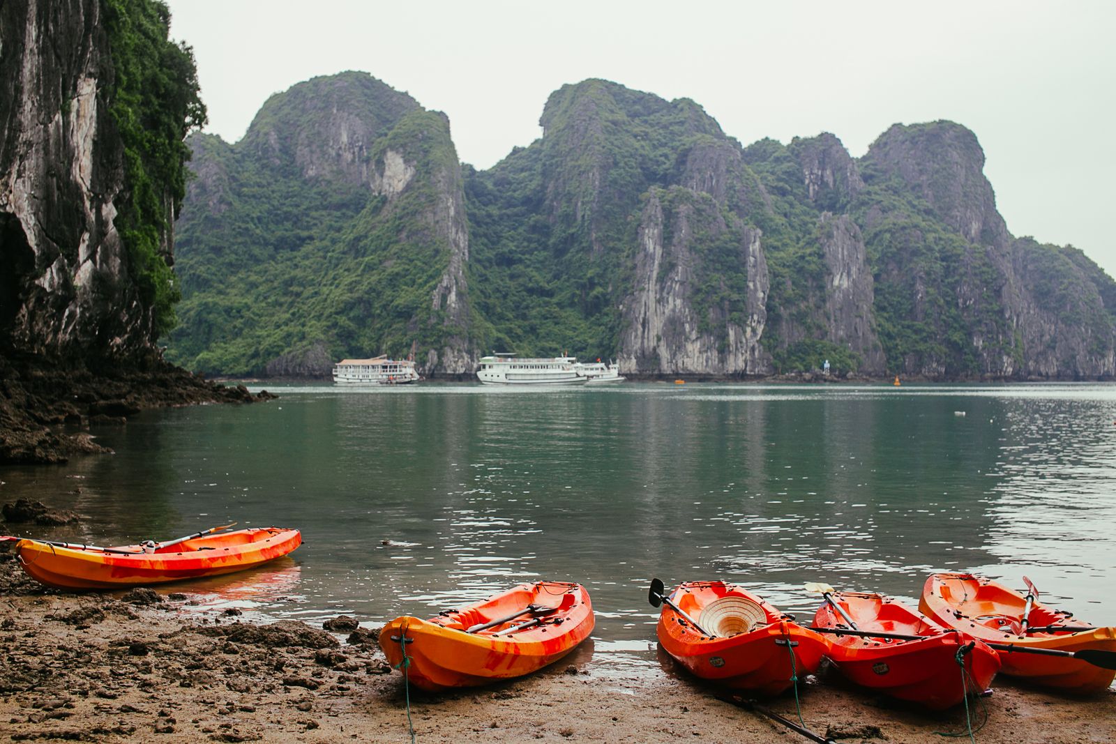 Kayak gliding between karsts in Lan Ha Bay